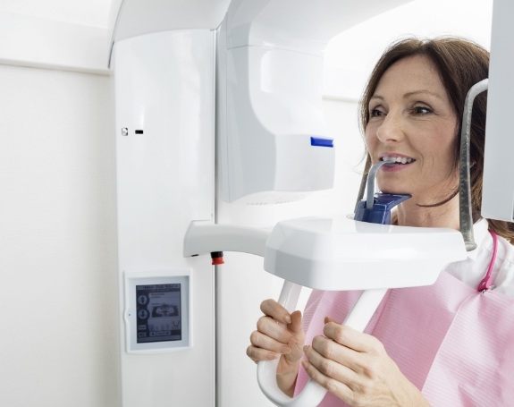 Patient receiving 3 D C T cone beam x-ray scans