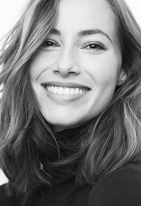 Black and white photo of woman with beautiful smile