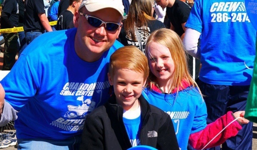 Dentist and young children at the Chardon Maple Festival