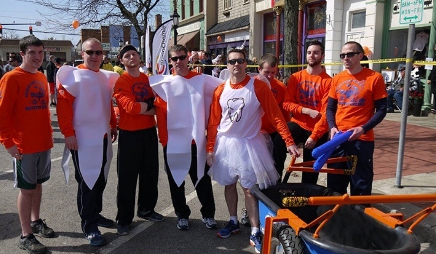 Dental team members wearing matching outfits at the Chardon Maple Festival