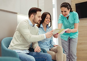 a couple looking at an in-house membership pamphlet