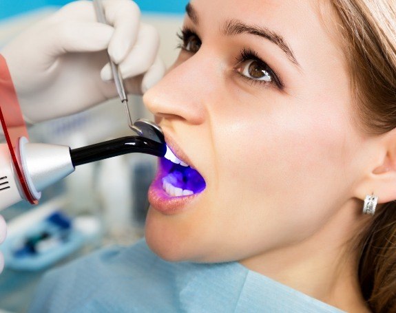 Patient receiving dental bonding treatment