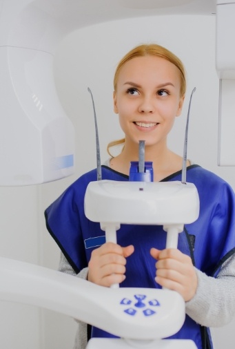 Woman receiving 3 D C T cone beam x-ray scans