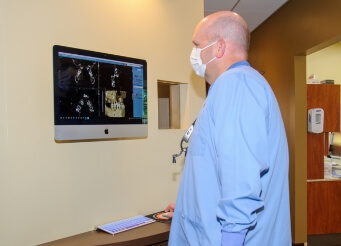 Dentist reviewing dental x-rays