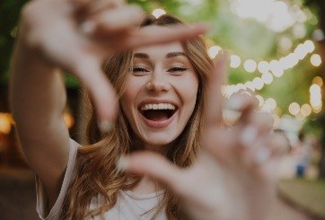 Woman sharing beauitful smile after cosmetic dentistry