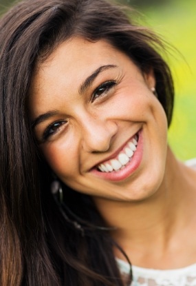 Woman with healthy smile after periodontal therapy