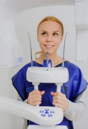 Woman receiving 3 D C T cone beam x-ray scan