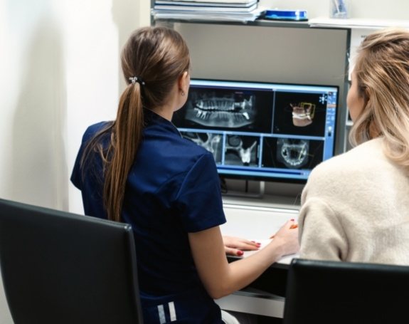 Dental team members reviewing digital x-rays