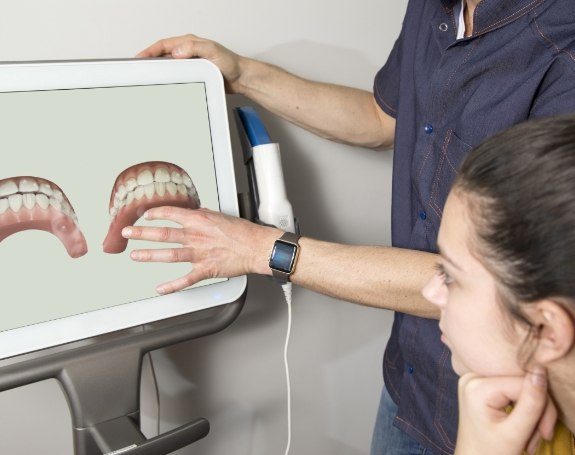Dentist looking at digital impressions