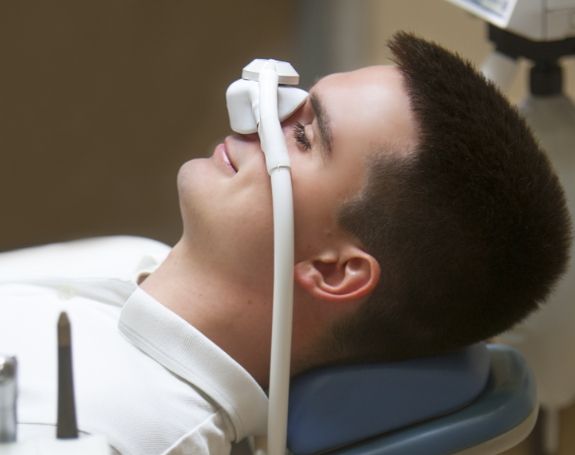 Patient receiving nitrous oxide dental sedation treatment