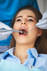 woman getting her teeth cleaned