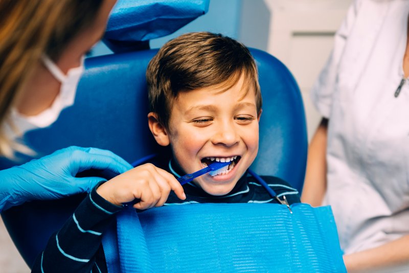 A child with a children's dentist in Chardon