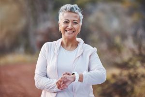 a woman smiling while she exercises