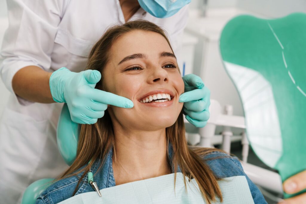 A woman smiling at the dentist’s office