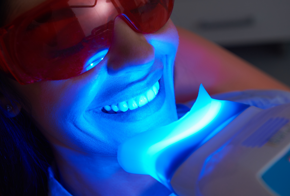 Woman undergoing dental teeth whitening